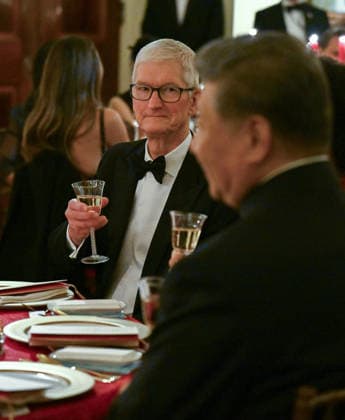 Apple Executive Chairman Tim Cook listens as President Donald Trump speaks during an official state dinner honoring Chinese President Xi Jinping at the White House in Washington DC on Thursday, September 24, 2026.  WAX20260924503 AnnabellexGordon