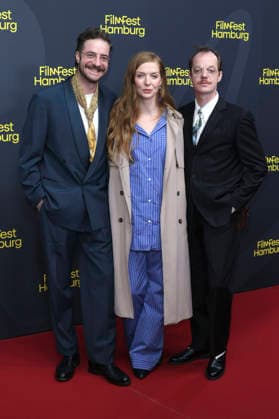 Fridolin Sandmeyer, Pheline Roggan, and Merlin Sandmeyer at the festival opening, featuring the premiere of the feature film *The Idiot s* at the 34th Filmfest Hamburg 2026 at Cinemaxx Dammtor in Hamburg, September 24, 2026 Foto:xgbrcix xFuturexImagex filmfest_hh_6761