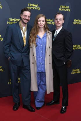 Fridolin Sandmeyer, Pheline Roggan, and Merlin Sandmeyer at the festival opening, featuring the premiere of the feature film *The Idiot s* at the 34th Filmfest Hamburg 2026 at Cinemaxx Dammtor in Hamburg, September 24, 2026 Foto:xgbrcix xFuturexImagex filmfest_hh_6762