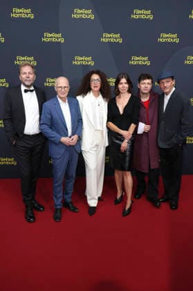Helge Albers, Peter Tschentscher, Malika Rabahallah, Malgorzata Szumowska, Michal Englert, and Christian Friedel at the festival opening with the premiere of the feature film *The Idiots* at the 34th Filmfest Hamburg 2026 at Cinemaxx Dammtor in Hamburg, September 24, 2026 Foto:xgbrcix xFuturexImagex filmfest_hh_6781