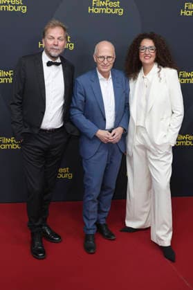 Helge Albers, Peter Tschentscher, and Malika Rabahallah at the festival opening, featuring the premiere of the film *The Idiots* at the 34th Filmfest Hamburg 2026 at Cinemaxx Dammtor in Hamburg, September 24, 2026 Foto:xgbrcix xFuturexImagex filmfest_hh_6783