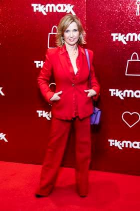 ABB TKMAXX Tina Ruland in a red pantsuit on the red carpet at the grand reopening of the TK Maxx store on Alexanderplatz on September 24, 2026, in Berlin, Germany