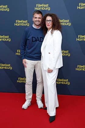 Christoph Pellander and Malika Rabahallah at the festival opening, featuring the premiere of the film *The Idiots* at the 34th Filmfest Hamburg 2026 at Cinemaxx Dammtor in Hamburg, September 24, 2026 Foto:xC.xTamckex xFuturexImagex filmfest_hh_6837