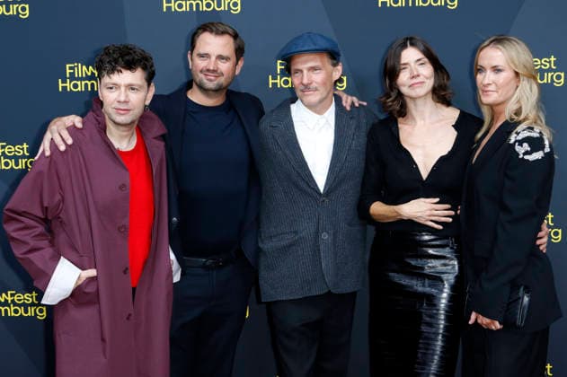 Christian Friedel, Michal Englert, Malgorzata Szumowska, and the cast and crew at the festival opening, featuring the premiere of the feature film *The Idiots* at the 34th Filmfest Hamburg 2026 at Cinemaxx Dammtor in Hamburg, September 24, 2026 Foto:xC.xTamckex xFuturexImagex filmfest_hh_6942