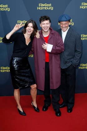 Malgorzata Szumowska, Christian Friedel, and Michal Englert at the festival opening, featuring the premiere of the feature film *The Idiots* at the 34th Filmfest Hamburg 2026 at Cinemaxx Dammtor in Hamburg, September 24, 2026 Foto:xC.xTamckex xFuturexImagex filmfest_hh_6944
