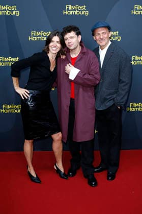 Malgorzata Szumowska, Christian Friedel, and Michal Englert at the festival opening, featuring the premiere of the feature film *The Idiots* at the 34th Filmfest Hamburg 2026 at Cinemaxx Dammtor in Hamburg, September 24, 2026 Foto:xC.xTamckex xFuturexImagex filmfest_hh_6945