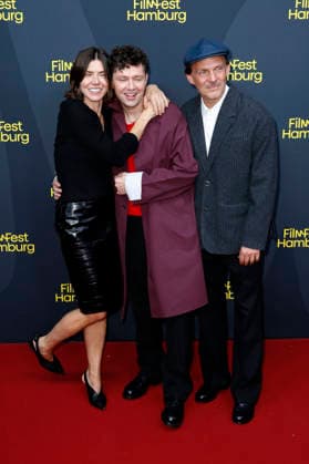 Malgorzata Szumowska, Christian Friedel, and Michal Englert at the festival opening, featuring the premiere of the feature film *The Idiots* at the 34th Filmfest Hamburg 2026 at Cinemaxx Dammtor in Hamburg, September 24, 2026 Foto:xC.xTamckex xFuturexImagex filmfest_hh_6947