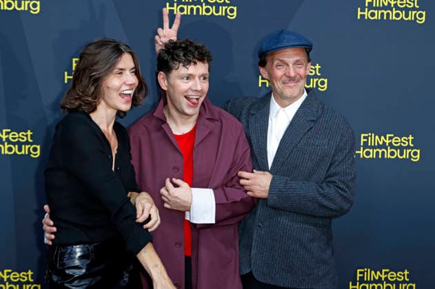 Malgorzata Szumowska, Christian Friedel, and Michal Englert at the festival opening, featuring the premiere of the feature film *The Idiots* at the 34th Filmfest Hamburg 2026 at Cinemaxx Dammtor in Hamburg, September 24, 2026 Foto:xC.xTamckex xFuturexImagex filmfest_hh_6948