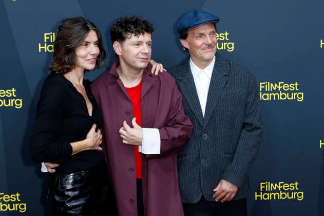 Malgorzata Szumowska, Christian Friedel, and Michal Englert at the festival opening, featuring the premiere of the feature film *The Idiots* at the 34th Filmfest Hamburg 2026 at Cinemaxx Dammtor in Hamburg, September 24, 2026 Foto:xC.xTamckex xFuturexImagex filmfest_hh_6949