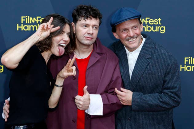Malgorzata Szumowska, Christian Friedel, and Michal Englert at the festival opening, featuring the premiere of the feature film *The Idiots* at the 34th Filmfest Hamburg 2026 at Cinemaxx Dammtor in Hamburg, September 24, 2026 Foto:xC.xTamckex xFuturexImagex filmfest_hh_6950