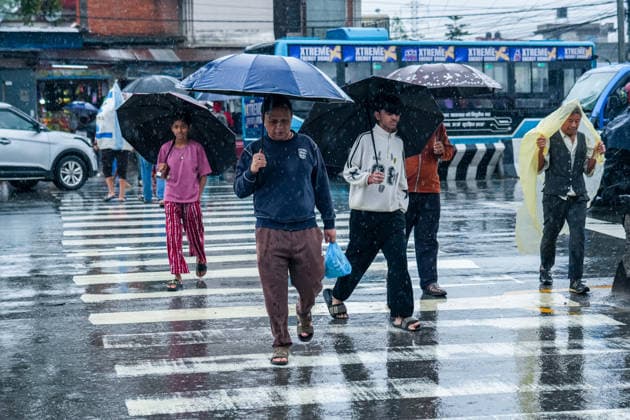 Heavy Rainfall Disrupts Daily Life in Kathmandu KATHMANDU, NEPAL September 25, 2026: People walk along a street carrying umbrellas amid heavy rainfall in Lalitpur, Nepal. The rainfall has disrupted daily activities as a deep depression over the Bay of Bengal continues to influence weather conditions in the region. (Photo by Hong Kong Nexpher Images) kathmandu Hong Kong