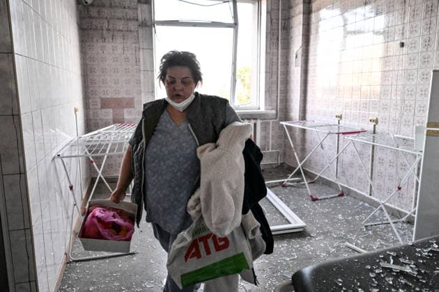 A woman walks out of a laundry room damaged by a Russian drone strike on a medical centre in Zaporizhzhia, Ukraine, September 25, 2026. Early on Friday, September 25, Russian drones attacked the southeastern city, injuring one person and setting fire to the medical centre. (Photo by Dmytro Smolienko Ukrinform) Russian drones attack medical centre in Zaporizhzhia  Copyright: xDmytroxSmolienkox