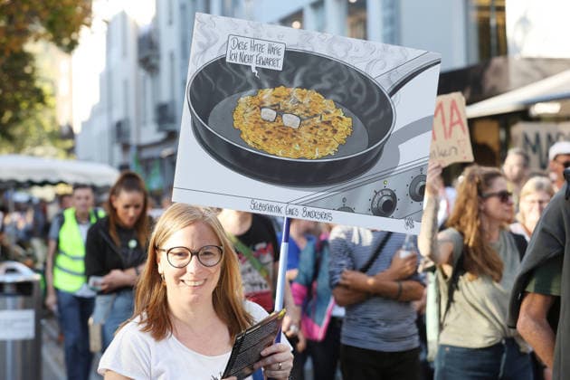 September 25, 2026, Baden AG, SWITZERLAND, Climate rally organized by the Greens and the SP: No 50-degree summers in Baden, Canton of Aargau —a reference to Federal Councilor Albert Roesti