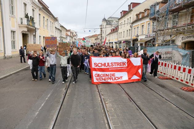 Protesters march down Friedrich-Ebert-Straße carrying a banner reading School Strike Against Conscription during a demonstration against conscription, Potsdam, September 25, 2026. School strike against conscription in Potsdam