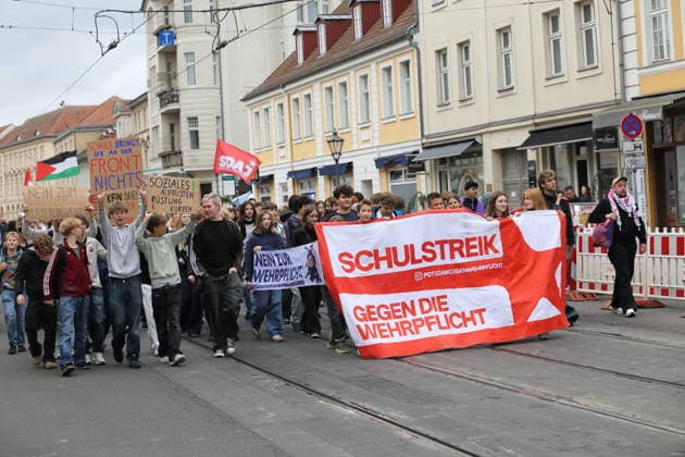 Protesters march down Friedrich-Ebert-Straße carrying a banner reading School Strike Against Conscription during a demonstration against conscription, Potsdam, September 25, 2026. School strike against conscription in Potsdam