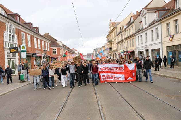 Protesters march down Friedrich-Ebert-Straße carrying a banner reading School Strike Against Conscription during a demonstration against conscription, Potsdam, September 25, 2026. School strike against conscription in Potsdam