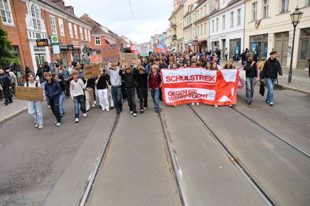 Protesters march down Friedrich-Ebert-Straße carrying a banner reading School Strike Against Conscription during a demonstration against conscription, Potsdam, September 25, 2026. School strike against conscription in Potsdam