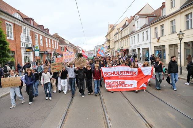 Protesters march down Friedrich-Ebert-Straße carrying a banner reading School Strike Against Conscription during a demonstration against conscription, Potsdam, September 25, 2026. School strike against conscription in Potsdam