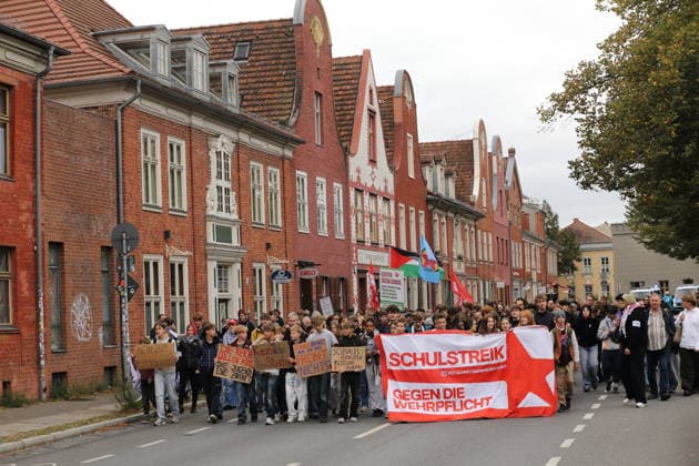 Protesters carrying a banner reading School Strike Against Conscription march down Kurfürstenstraße during a demonstration against conscription, Potsdam, September 25, 2026. School strike against conscription in Potsdam