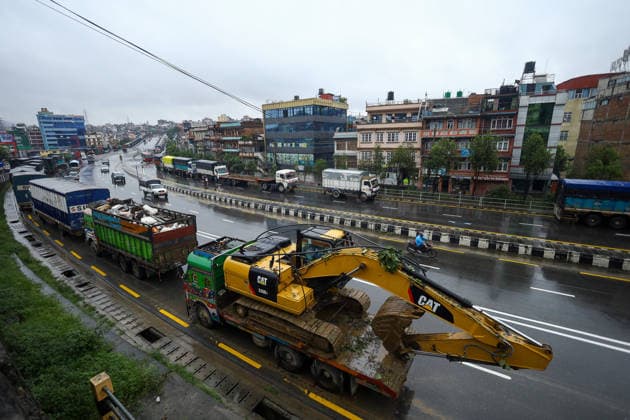 Red Alert Issued In Parts Of Nepal As Landslide Blocks Highways, Water Level Surge High Following Incessant Rainfall Heavy vehicles and trucks are parked along the Ring-road highway in Kathmandu, on September 25, 2026, after landslides blocked major highways and exit points from the capital following days of continuous rainfall. The Weather Forecasting Division under the Department of Hydrology and Meteorology (DHM) issued a five-day special weather warning bulletin, advising the public and agencies to remain alert on Friday and Saturday as rainfall and weather-related hazards are expected to increase across the country. In Kathmandu, the Bagmati River has swollen and breached its embankments following more than 36 hours of continuous rainf  Copyright: xSubaasxShresthax originalFilename: shrestha-redalert260925_np3Y7.jpg