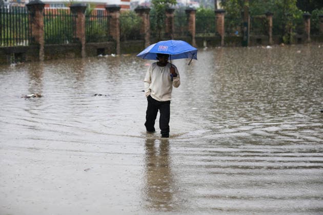 Red Alert Issued In Parts Of Nepal As Landslide Blocks Highways, Water Level Surge High Following Incessant Rainfall A person wades through floodwater from the Bagmati River in Kathmandu, Nepal, on September 25, 2026. The river has swollen and breached its embankments following heavy rain over two days. The Weather Forecasting Division under the Department of Hydrology and Meteorology (DHM) has issued a five-day special weather warning bulletin, urging the public and concerned agencies to remain alert Friday and Saturday as rainfall and weather-related hazards are expected to increase across various parts of the country. The DHM has warned of light to heavy rainfall and weather-related disasters in different parts of the country from Friday  Copyright: xSubaasxShresthax originalFilename: shrestha-redalert260925_npW1i.jpg
