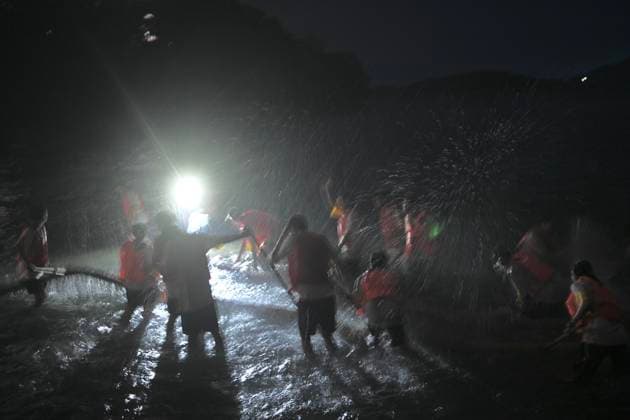 RECORD DATE NOT STATED Hong Kong Pok Fu Lam Village Fire Dragon 2026 Performers putting a Fire Dragon into the sea during a fire dragon dance performance in Wah Fu Estate at Mid-autumn Festival on September 25, 2026 in Hong Kong. (Photo by Kobe Li Nexpher Images) Hong Kong