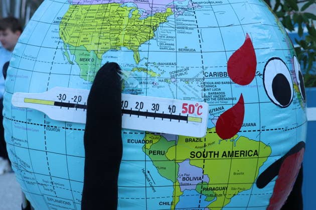 September 25, 2026, City of Lucerne: Demonstration, climate rally in Lucerne against climate change, under the slogan No 50-Degree Summers. Photo: Protesters holding a globe and a thermometer.