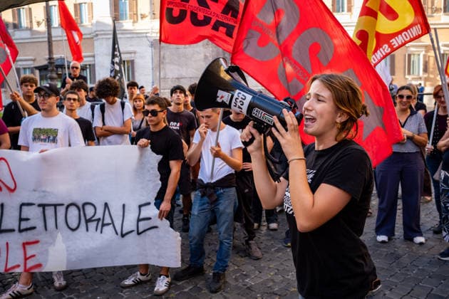 September 25, 2026, Rome, Rm, Italy: Students are taking to the streets to march on Montecitorio - Chamber of Deputies - to protest the new school decree-law issued yesterday by the Meloni government, arguing that the real issues facing schools lie elsewhere. Students call it the Racism Decree because it establishes, among other things, a cap on the number of foreign students per class and bans the wearing of the niqab and burqa during lessons. No to the Racism Decree. Less election campaigning, more funding for schools reads the banner. Rome Italy  - ZUMAg256 20260925_znp_g256_005 Copyright: xMarcoxDixGianvitox