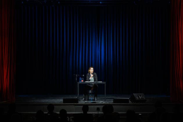 Christine Prayon at the Kulturbeutel Festival in Speyer, Speyer, Germany, September 25, 2026. Cabaret artist Christine Prayon sits alone at a table on stage during her show Farewell Tour at the opening of the Kulturbeutel Festival in the Alter Stadtsaal.