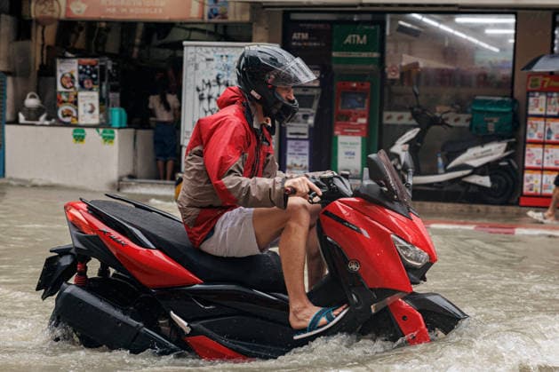 September 26, 2026, Thailand: A man rides a motorbike along flooded street due to heavy rain in Bangkok, Thailand, Saturday, September 26, 2026. All 50 districts of Bangkok have been declared disaster areas and residents along canal areas have been advised to move to higher ground. Thailand - ZUMAm249 20260926_zip_m249_008 Copyright: xAndrexMalerbax