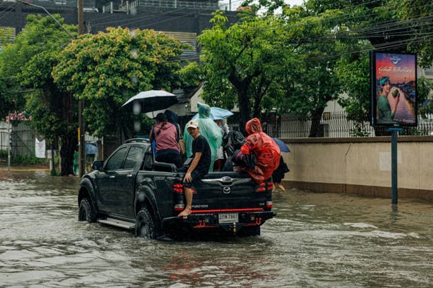 September 26, 2026, Thailand: A pickup truck carrying people drives down a flooded street due to heavy rain in Bangkok, Thailand, Saturday, September 26, 2026. All 50 districts of Bangkok have been declared disaster areas and residents along canal areas have been advised to move to higher ground. Thailand - ZUMAm249 20260926_zip_m249_020 Copyright: xAndrexMalerbax