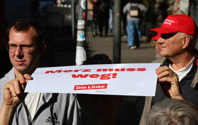 September 26, 2026, Nuremberg, Bayern, Germany: a protester holds a banner against the germany Chancellor Merz during the Demonstration against the labor reform in Nuremberg , Bayern , Germany . September 26th, 2026 Nuremberg Germany  - ZUMAe140 20260926_zip_e140_022 Copyright: xDavidexEliasx
