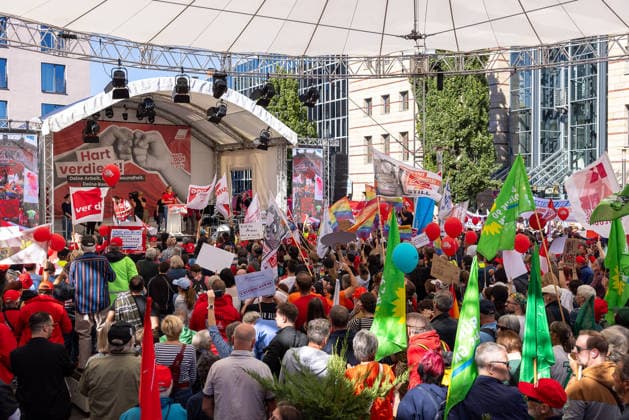 DGB Bavaria Hard-Earned Mass Rally, Nuremberg, September 26, 2026. On a large stage bearing the slogan Hard-Earned, Christiane Benner, President of IG Metall, addresses a large crowd. Numerous participants hold up flags, banners, and balloons. Nuremberg, Bavaria, Germany 20260926-286A9264-M4000