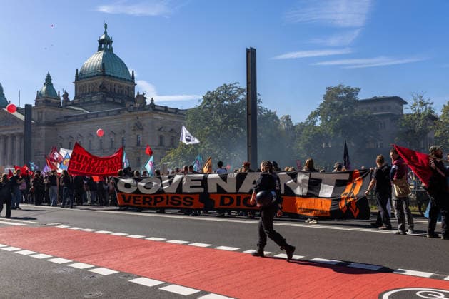 September 26, 2026, Leipzig, Saxony, Germany: Demonstrators participate in an UnkoÂ¼rzbar rally in Leipzig, Germany, on September 26, 2026, protesting cuts to social services and criticizing government spending priorities. Among the signs displayed during the demonstration were messages opposing increased investment in the arms industry and criticizing the Covenant military technology project in Leipzig. Protesters carried banners and placards calling for greater investment in social services and addressing issues including public spending, employment, pensions, healthcare and military expenditure. The demonstration took place in central Leipzig as part of the wider UnkoÂ¼rzbar campaign against cuts to social services. Leipzig Germany - ZUMAc291 20260926_zip_c291_012 Copyright: xMariaxCastrox