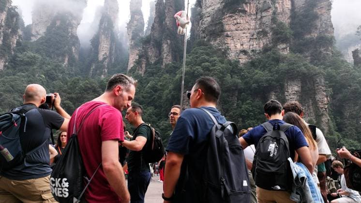 ZHANGJIAJIE, CHINA - SEPTEMBER 26: Tourists enjoy the scenic landscapes at Zhangjiajie National Forest Park during the Mid-Autumn Festival holiday on September 26, 2026 in Zhangjiajie, Hunan Province of China. The park features lush green mountains and clear autumn weather, attracting domestic and international visitors for vacation and leisure.  Copyright: xVCGx 111669753031