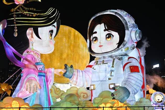 RECORD DATE NOT STATED Hong Kong daily life Large illuminated figures depicting a traditional Hanfu and an astronaut are displayed during a nighttime event in Hung Hom New Waterfront, the day after the Mid-Autumn Festival on September 26, 2026 in Hong Kong. (Photo by Kobe Li Nexpher Images) Hong Kong