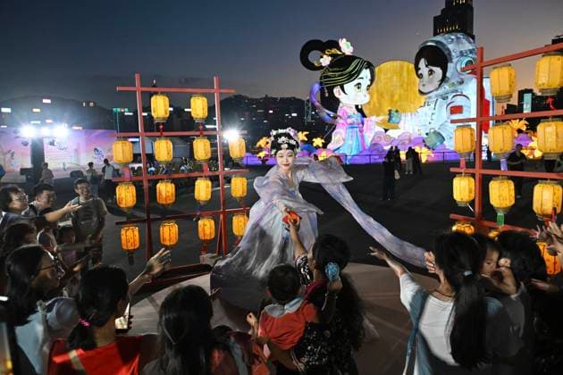 RECORD DATE NOT STATED Hong Kong daily life Visitors watch as a performer in traditional Hanfu attire performs in Hung Hom New Waterfront the day after the Mid-Autumn Festival on September 26, 2026 in Hong Kong. (Photo by Kobe Li Nexpher Images) Hong Kong
