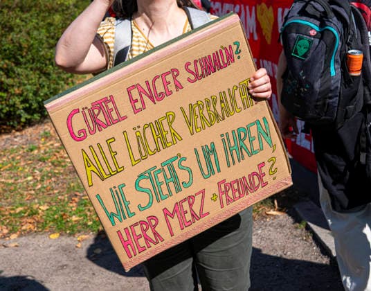 Social protests organized by the DGB EUR, Germany, Berlin, September 26, 2026 There’s Enough for Everyone, and Merz Must Go —posters, banners, and slogans against the federal government’s cuts to social benefits. Cutting Social Benefits —nationwide social protests organized by the DGB and its member unions under the slogan You’ve Earned It: Your Work, Your Health, Your Pension