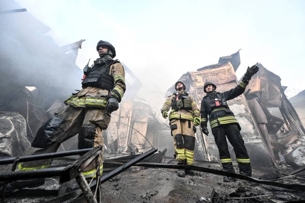 State Emergency Service rescuers work amid burnt-out metal containers at the Central Clothes Market (Anholenko) in Zaporizhzhia, Ukraine, September 26, 2026. The market sustained significant damage in a Russian drone attack. (Photo by Dmytro Smolienko Ukrinform) Russian troops strike clothes market in Zaporizhzhia  Copyright: xDmytroxSmolienkox
