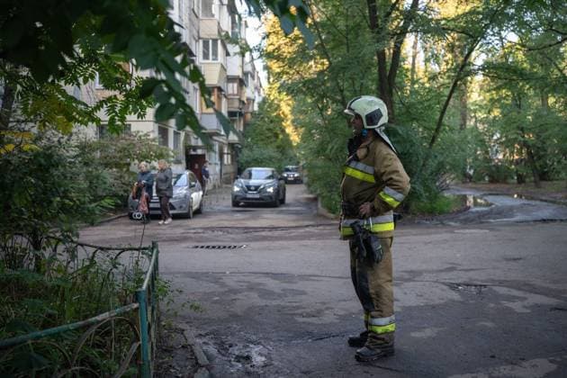 September 26, 2026, Kyiv, Ukraine: KYIV, UKRAINE, SEPTEMBER 26, 2026: Firefighters work at a five-story residential building damaged during a Russian drone attack in KyivÃ¢â‚¬â ¢s Solomianskyi district, as residents watch emergency operations and clear shattered glass from the area. Kyiv authorities said a fire broke out at the residential building and a ground-floor shop following the fall of a drone, injuring four people and prompting rescuers to evacuate 20 residents. Kyiv Ukraine - ZUMAq101 20260926_zna_q101_082 Copyright: xNastassiaxKantorowiczxTorresx