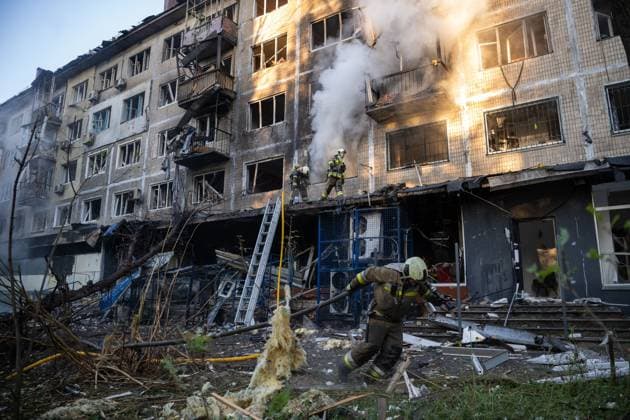 September 26, 2026, Kyiv, Ukraine: KYIV, UKRAINE, SEPTEMBER 26, 2026: Firefighters work at a five-story residential building damaged during a Russian drone attack in KyivÃ¢â‚¬â ¢s Solomianskyi district, as residents watch emergency operations and clear shattered glass from the area. Kyiv authorities said a fire broke out at the residential building and a ground-floor shop following the fall of a drone, injuring four people and prompting rescuers to evacuate 20 residents. Kyiv Ukraine - ZUMAq101 20260926_zna_q101_098 Copyright: xNastassiaxKantorowiczxTorresx