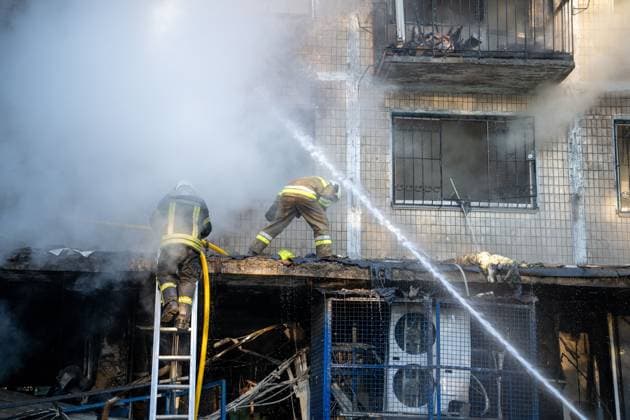 September 26, 2026, Kyiv, Ukraine: KYIV, UKRAINE, SEPTEMBER 26, 2026: Firefighters work at a five-story residential building damaged during a Russian drone attack in KyivÃ¢â‚¬â ¢s Solomianskyi district, as residents watch emergency operations and clear shattered glass from the area. Kyiv authorities said a fire broke out at the residential building and a ground-floor shop following the fall of a drone, injuring four people and prompting rescuers to evacuate 20 residents. Kyiv Ukraine - ZUMAq101 20260926_zna_q101_099 Copyright: xNastassiaxKantorowiczxTorresx