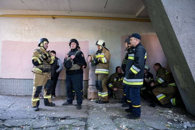 September 26, 2026, Kyiv, Ukraine: KYIV, UKRAINE, SEPTEMBER 26, 2026: Firefighters work at a five-story residential building damaged during a Russian drone attack in KyivÃ¢â‚¬â ¢s Solomianskyi district, as residents watch emergency operations and clear shattered glass from the area. Kyiv authorities said a fire broke out at the residential building and a ground-floor shop following the fall of a drone, injuring four people and prompting rescuers to evacuate 20 residents. Kyiv Ukraine - ZUMAq101 20260926_zna_q101_101 Copyright: xNastassiaxKantorowiczxTorresx