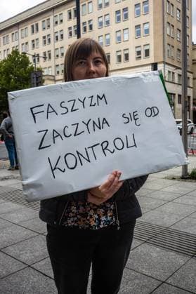 September 26, 2026, Warsaw, Mazovia, Poland: A protester holds a placard that says, in Polish, Fascism starts with control ..Left-wing antifascist activists gather outside the European Union Commission building in Warsaw to protest against the Chat Control 1.0 legislation recently revived by the European Parliament. The legislation allows for the mass scanning of messages belonging to every European Union citizen for Child Sexual Abuse Material (CSAM) in the name of protecting children s rights and combating pedophilia. The activists, however, believe rights to privacy and the foundations of free speech are being trampled upon, especially with talks due to resume regarding the far more dangerous Chat Control 2.0 bill, which aims to r - ZUMAs197 20260926_aaa_s197_196 Copyright: xNeilxMiltonx