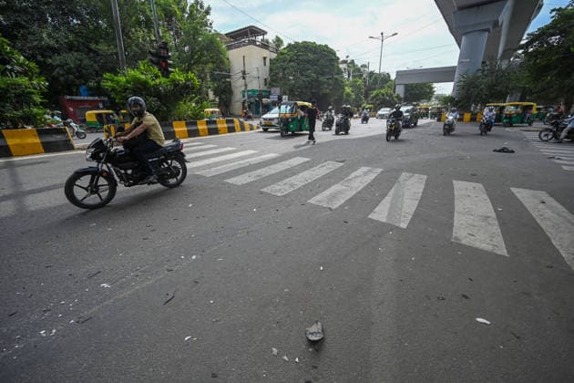 NEW DELHI, INDIA - SEPTEMBER 26: A view of the accident spot near Sukhdev Vihar Metro Station, where a 45-year-old auto-rickshaw driver was killed and another person injured after a speeding car allegedly rammed into an auto-rickshaw and a cycle rickshaw, on September 26, 2026 in New Delhi, India. According to a witness, two cars were speeding alongside each other around 6:30 am when the white i20 lost control and first hit the auto-rickshaw before crashing into a rickshaw passing nearby. The witness, who runs a tea stall close to the accident site, said the i20 had around three to four people inside. He claimed the driver stepped out after the collision and fled in another vehicle along with his associates. (Photo by Sanchit Khanna Hindust