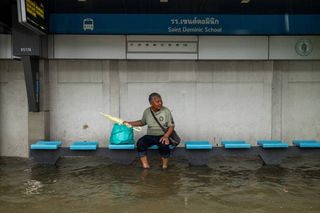 Bangkok Thailand Flooding September 26 A man sits at a bus stop surrounded by floodwater along Thanon Phetchaburi following heavy rain in Bangkok, Thailand on September 26, 2026. Heavy rainfall caused flooding in parts of Bangkok, inundating roads and disrupting traffic and daily life. Bangkok Bangkok Thailand Copyright: xNicolaxLongobardix