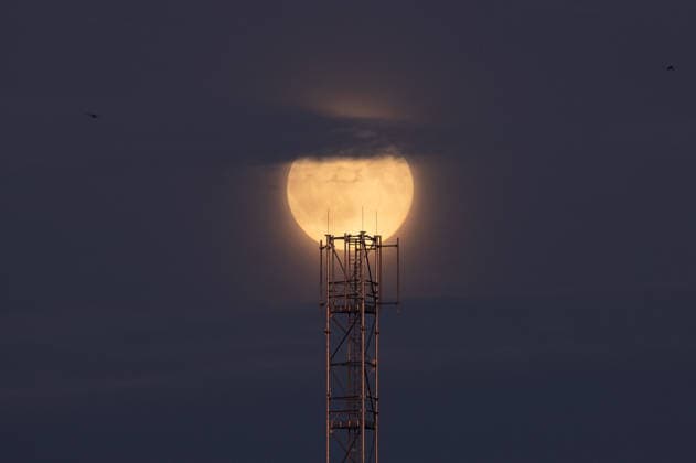 Full harvest Moon rises above the Slovak-Ukrainian border CIERNA, SLOVAKIA - SEPTEMBER 26: The full Harvest Moon rises above an antenna tower near the Slovak-Ukrainian border at the outskirts of Cierna, Slovakia, on September 26, 2026. The orange-hued Moon, with its prominent craters and dark lunar plains visible, appears above the village as evening falls. Known as the Harvest Moon, September’s full moon is traditionally associated with the full moon closest to the autumnal equinox and historically provided farmers with additional light for working in the fields after sunset. Robert Nemeti Anadolu Cierna Slovakia. Editorial use only. Please get in touch for any other usage.  Copyright: x2026xAnadoluxRobertxNemetix