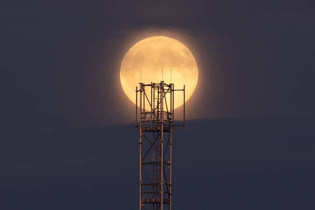 Full harvest Moon rises above the Slovak-Ukrainian border CIERNA, SLOVAKIA - SEPTEMBER 26: The full Harvest Moon rises above an antenna tower near the Slovak-Ukrainian border at the outskirts of Cierna, Slovakia, on September 26, 2026. The orange-hued Moon, with its prominent craters and dark lunar plains visible, appears above the village as evening falls. Known as the Harvest Moon, September’s full moon is traditionally associated with the full moon closest to the autumnal equinox and historically provided farmers with additional light for working in the fields after sunset. Robert Nemeti Anadolu Cierna Slovakia. Editorial use only. Please get in touch for any other usage.  Copyright: x2026xAnadoluxRobertxNemetix