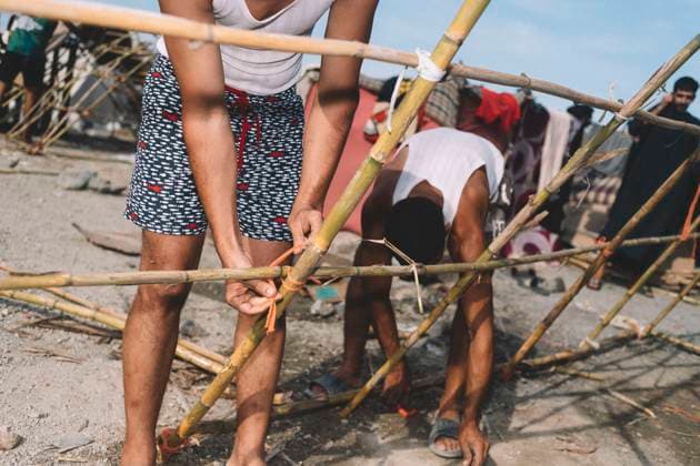 September 26, 2026, Ceuta, Ceuta, Spain: Migrants tie cane poles together to build a shelter at an informal settlement on the coast of Ceuta. Thousands of migrants, most of them young Moroccan men, have been living in makeshift settlements in the Spanish North African enclave of Ceuta since a mass arrival at the end of July 2026 set off a migration and political crisis. Ceuta Spain - ZUMAs392 20260926_zip_s392_006 Copyright: xFabianxSuspensivox