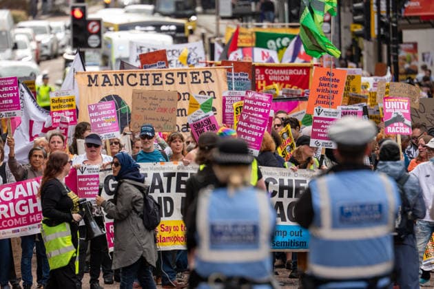 September 26, 2026, Manchester, United Kingdom: Protesters hold banners and placards during the demonstration. Activists in Manchester march for Stand Up To Racism against the far right. In addition to anti-racist slogans promoting diversity and migrant rights, demonstrators carried banners of the RNLI (Royal National Lifeboat Institution) following recent Patriot Platform protests. The broad coalition of trade unions, community groups, and political organisations featured prominent banners from BECTU (Broadcasting, Entertainment, Communications and Theatre Union) and Jewish Voice for Labour (JVL). Manchester, United Kingdom. Manchester United Kingdom - ZUMAs197 20260926_aaa_s197_220 Copyright: xGaryxRobertsx